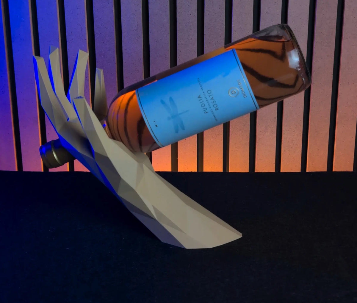 Bottle with blue label on a black background