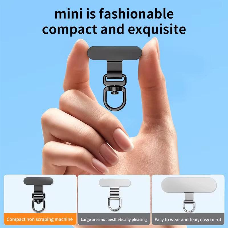 Small black clip held between fingers with text on a blue background