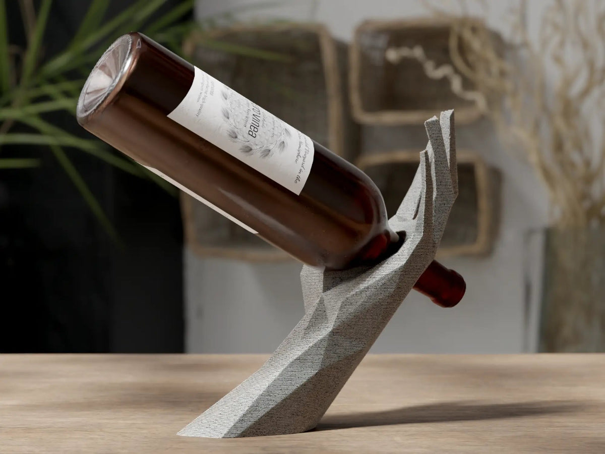 Wine bottle on a unique stone holder with a blurred background