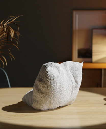 Textured stone on a wooden surface with a blurred indoor background