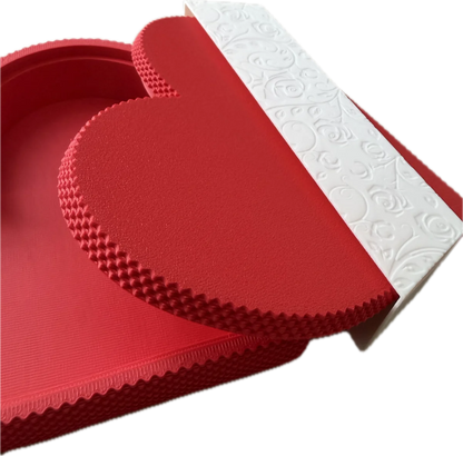 Red textured mat with embossed pattern on a white background