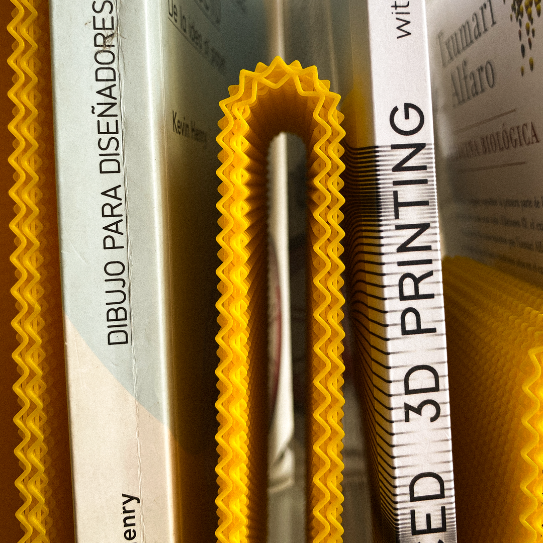Close-up of a 3D printed object with text and branding