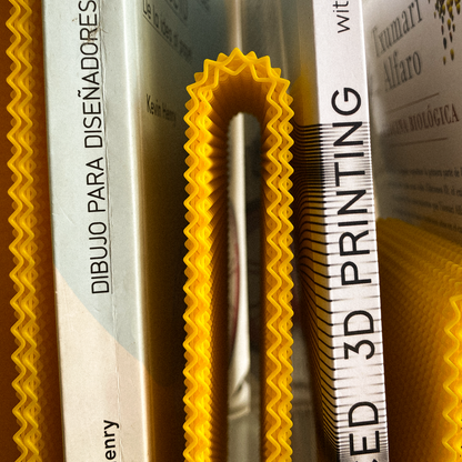 Close-up of a 3D printed object with text and branding