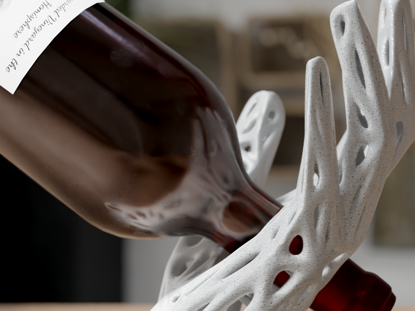 Red wine being poured into a white ceramic wine decanter with intricate design.