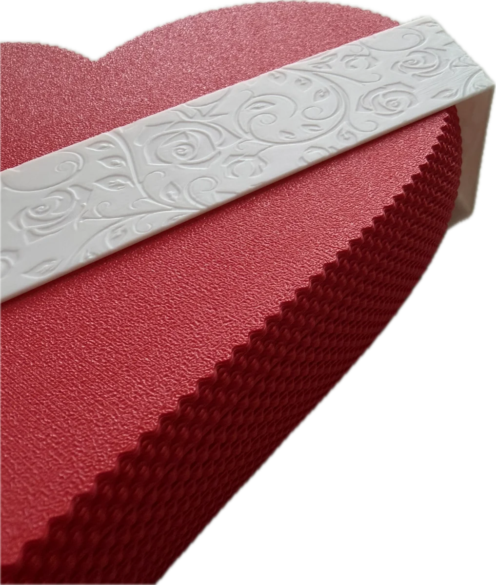 Red textured object with a white embossed band on a white background